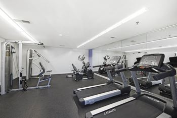 A gym with treadmills, weights, and exercise equipment at acclaim at sterling in sterling, va